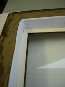 The glass was taped into the frame with white, acid-free, gummed tape to keep out dust and thrips. 